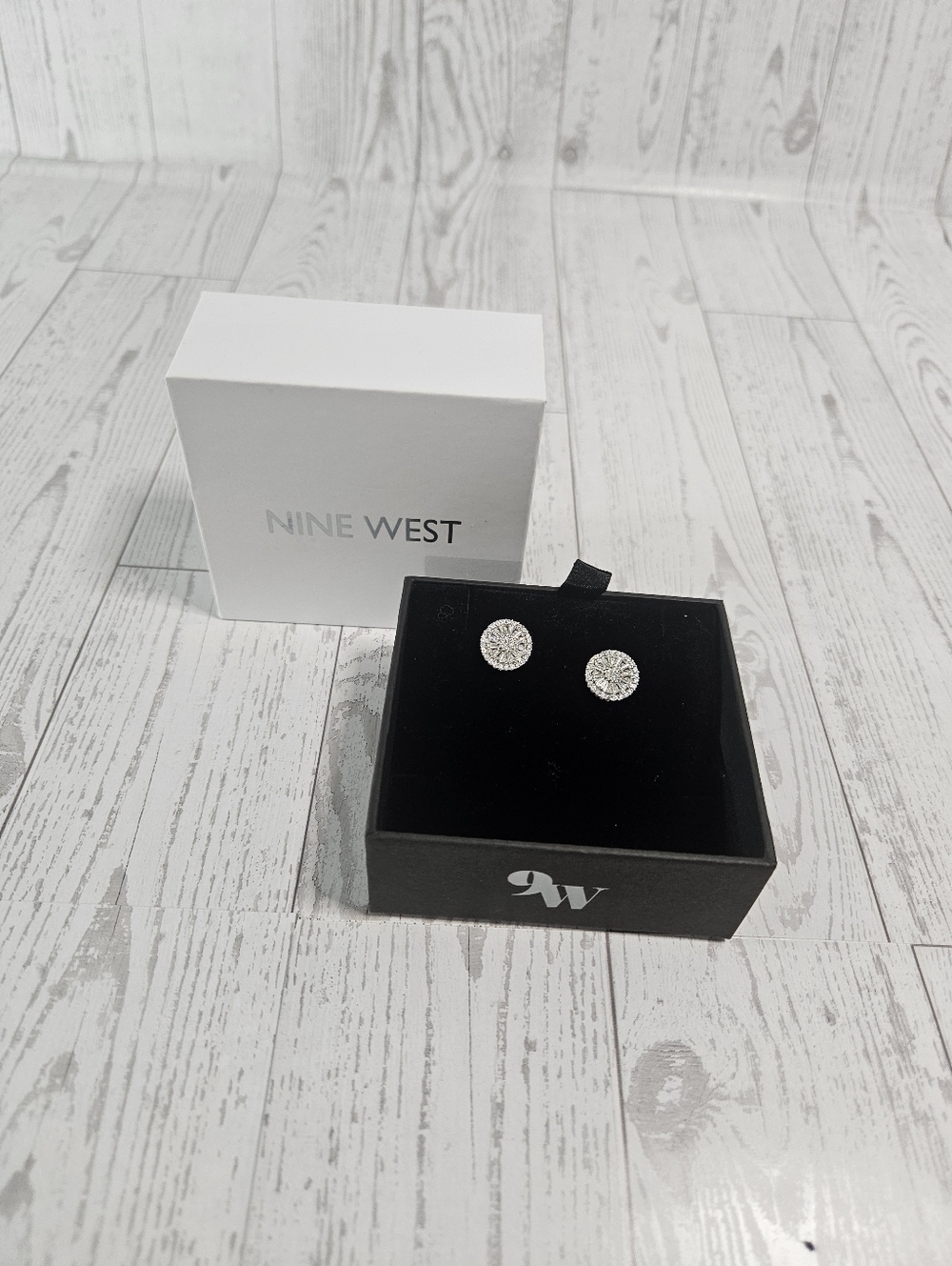 Nine West round stud earrings feature a cluster of cubic zirconia stones set